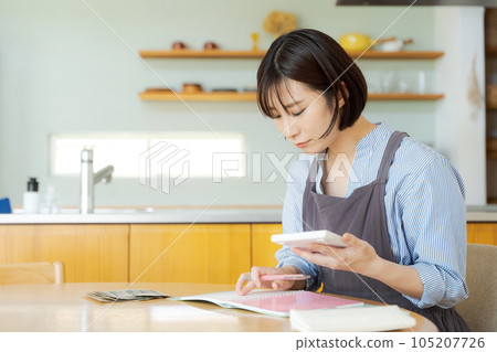 Woman counting bills Woman counting bills 105207726