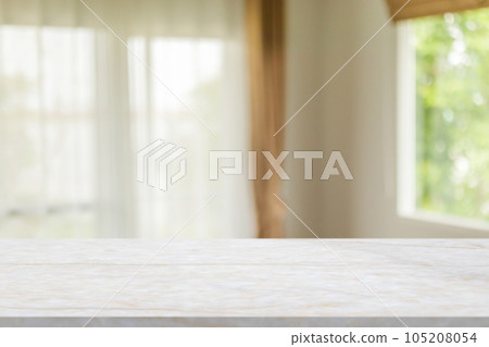 Marble table with blur room interior with window curtain background 105208054