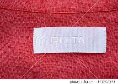White blank clothing tag label on red linen shirt fabric texture background White blank clothing tag label on red linen shirt fabric texture background 105208373