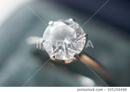 Diamond ring in jewelry gift box close up background 105208496