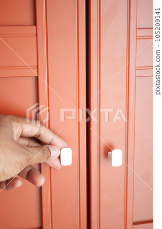 top view of men hand open a a drawer top view of men hand open a a drawer 105209141