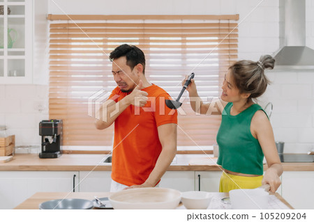 Husband taste wife cook and pretend that it is delicious. Funny couple. Husband taste wife cook and pretend that it is delicious. Funny couple. 105209204