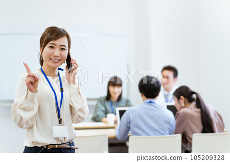 businesswoman using smart phone in office businesswoman using smart phone in office 105209328