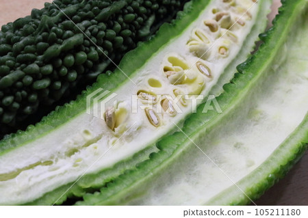 Cross section of cut bitter gourd Cross section of cut bitter gourd 105211180