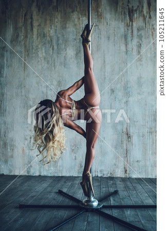 Woman pole dancing 105211645