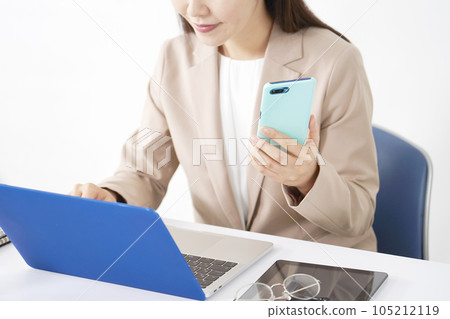 Business woman doing desk work using a laptop No face 105212119