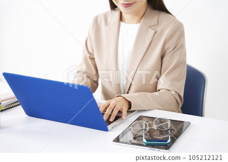 Business woman doing desk work using a laptop No face 105212121
