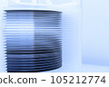 A lot of silicon wafers packed in a plastic storage box in the clean room of a semiconductor foundry ready for microchip production. 105212774