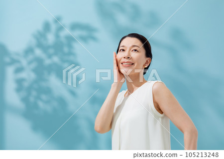 Beauty sunshine filtering through trees Senior woman Beauty sunshine filtering through trees Senior woman 105213248