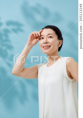 Beauty sunshine filtering through trees Senior woman 105213249