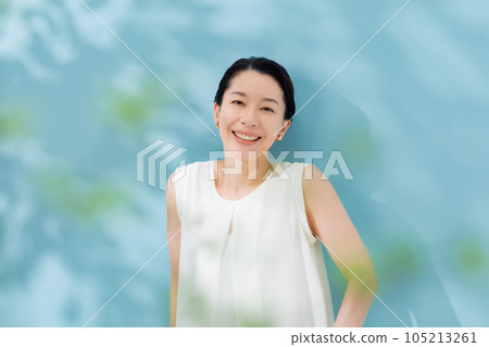 Beauty sunshine filtering through trees Senior woman 105213261