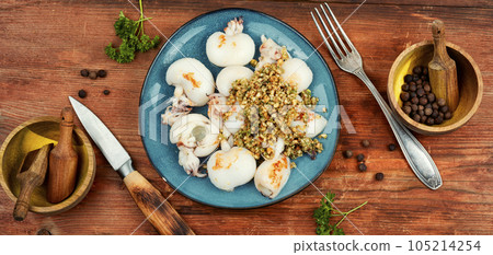 Grilled calamari squid with nuts. Grilled calamari squid with nuts. 105214254