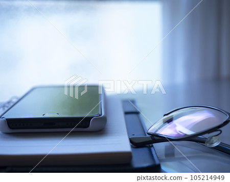 Notebook, glasses and smartphone on the table Notebook, glasses and smartphone on the table 105214949