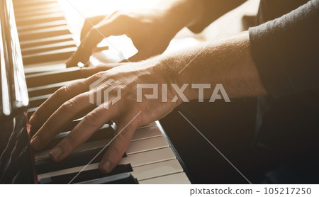 Hands playing piano 105217250