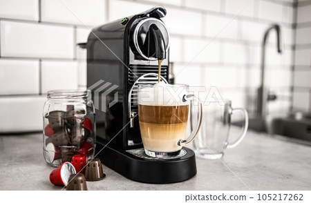 Capsule coffee machine at domestic kitchen 105217262