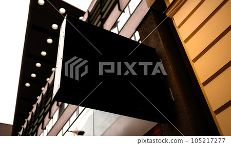 Black billboard in the city street for your text, logo or design Black billboard in the city street for your text, logo or design 105217277