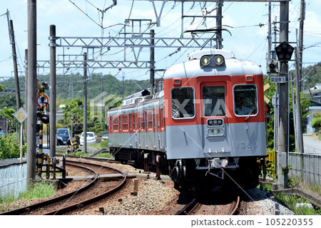 It is a Kobe Electric Railway vehicle wearing reprint colors of orange and silver gray. 105220355
