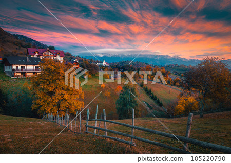 Small alpine village on the hill at sunset, Romania 105220790