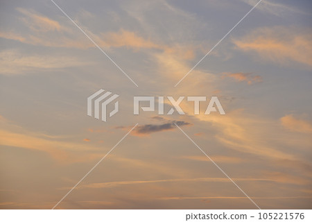 Sunset evening and red-blue clouds in the sky. Beautiful clouds in the evening. Sunset evening and red-blue clouds in the sky. Beautiful clouds in the evening. 105221576