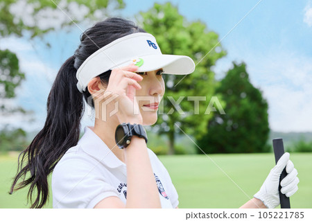Women playing golf Women playing golf 105221785