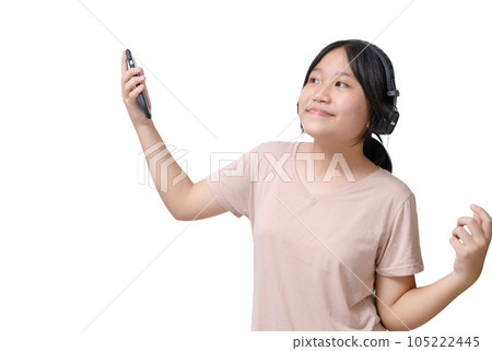 Charming asian girl wear headphones holding mobile phone listen music song mood enjoy on white background. 105222445