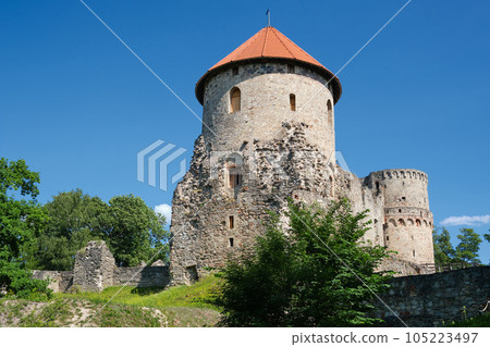 Latvian tourist landmark attraction - Ruins of the medieval Livonian castle, stone walls and towers  in Cesis, Latvia. 105223497