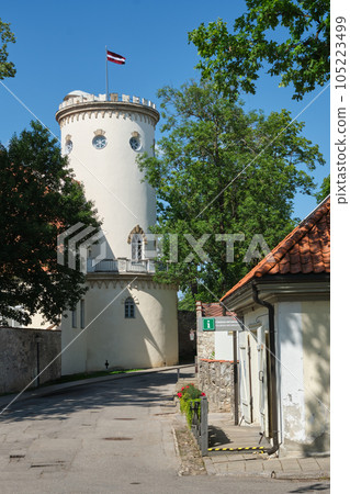 Latvian tourist landmark attraction - Tower of white castle. Part of ancient Livonian castle ruins in old town of Cesis, Latvia. 105223499