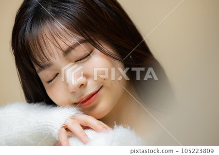 Woman in white knit Woman in white knit 105223809