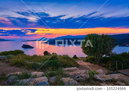 Sunset over Greek islands at Mediterranean sea, bay of Sounio, Greece. 105224866