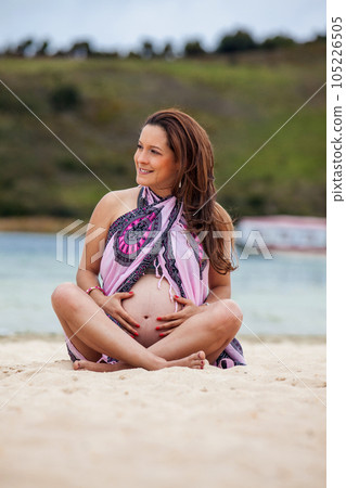 Portrait of a young woman waiting for her baby at the beautiful white beach of Lake Tota located in the department of Boyaca at 3,015 meters above sea level in Colombia Portrait of a young woman waiting for her baby at the beautiful white beach of Lake Tota located in the department of Boyaca at 3,015 meters above sea level in Colombia 105226505