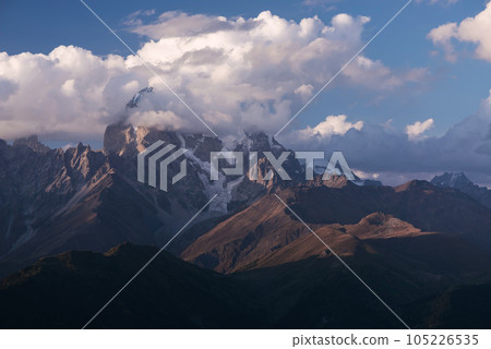 Beautiful mountain peak in the clouds Beautiful mountain peak in the clouds 105226535