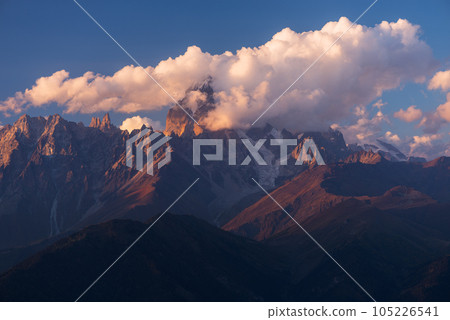 Beautiful mountain peak in the clouds Beautiful mountain peak in the clouds 105226541