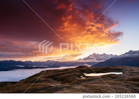 Mountain landscape with a beautiful sunrise 105226560