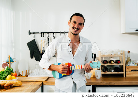 Happy gay man spending time at home, People relaxing and resting at modern house, People lifestyle, Man with music 105226642