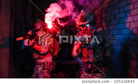 Expert team of soldiers attacking enemy during military operation, Army soldiers in protective combat uniform, Soldiers with rifle on world war field Expert team of soldiers attacking enemy during military operation, Army soldiers in protective combat uniform, Soldiers with rifle on world war field 105226645