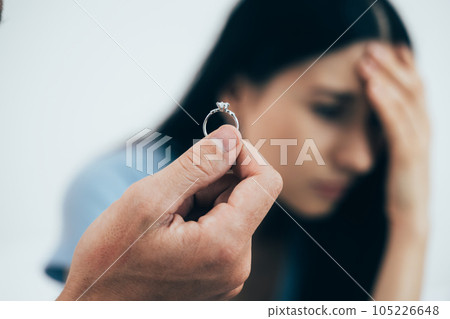 Upset and unhappy couple with problems, Young couple having quarrel at home, Relationship with problems, Conflicts in marriage Upset and unhappy couple with problems, Young couple having quarrel at home, Relationship with problems, Conflicts in marriage 105226648