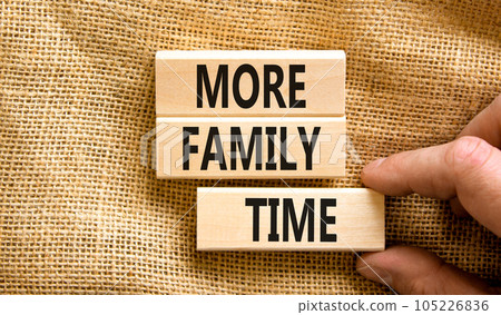 More family time and support symbol. Concept words More family time on wooden blocks. Businessman hand. Beautiful canvas table canvas background. Business, more family time qoute concept. Copy space. 105226836