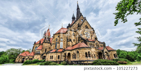 Saint Martin church in Neustadt, Dresden, Germany. Amazing architecture with high towers and red roof. Saint Martin church in Neustadt, Dresden, Germany. Amazing architecture with high towers and red roof. 105227273