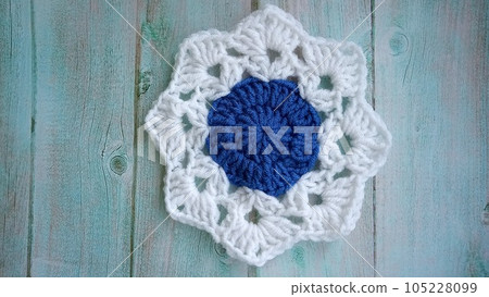 Blue, white crochet elements and orchid. Crochet texture, place for an inscription, adapted for mobile phone 105228099