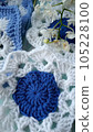 Blue, white crochet elements and orchid. Crochet texture, place for an inscription, adapted for mobile phone 105228100