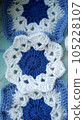 Blue, white crochet elements and orchid. Crochet texture, place for an inscription, adapted for mobile phone 105228107