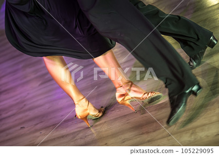 Legs of young dancers on the dance floor Legs of young dancers on the dance floor 105229095