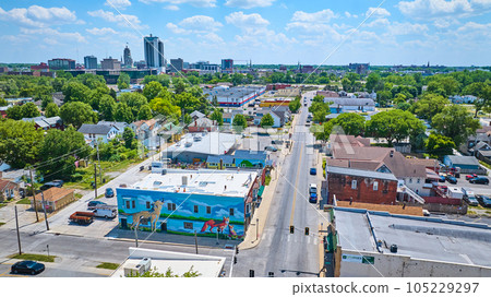 West Fourth Street and Wells Street downtown Fort Wayne fox and wolf mural with distant skyscrapers 105229297