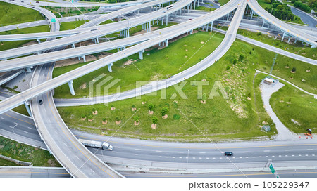 Greenery around looping highway suspended roads aerial 105229347