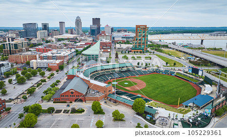 Downtown skyscraper background with white gold truss bridge over river near Louisville Slugger Field 105229361