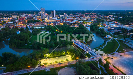 Night lights in skate park near MLK bridge leading into nightlife downtown Fort Wayne aerial 105229363