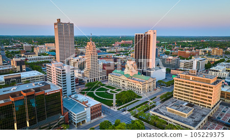 Sunrise glow over downtown city Fort Wayne IN skyscrapers and courthouse summer 105229375