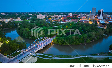 Martin Luther King Bridge leading to Headwaters Park and downtown Fort Wayne night lights aerial 105229386