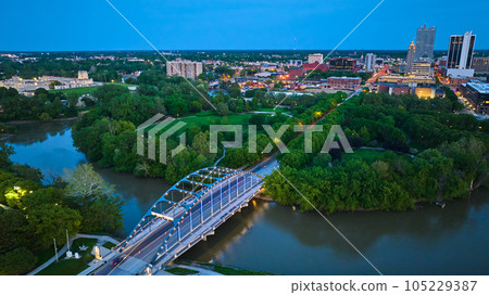 Aerial Martin Luther King Bridge downtown Fort Wayne aerial with park and buildings at dusk 105229387