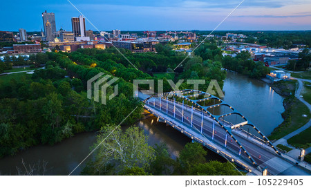 Aerial Martin Luther King Bridge at dusk with city lights and river 105229405